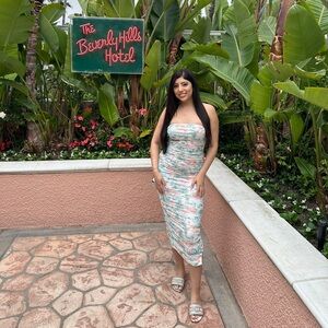 Tube dress, fits snuggly. Perfect for bridal shower or a cute brunch.